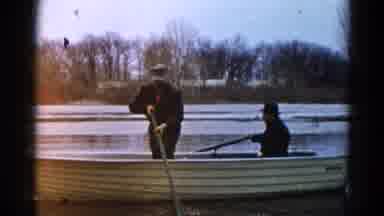 Wauconda Illinois USA (1961): Two Men Shove Off And Row Yellow Boat On Pond On