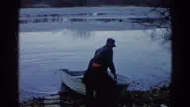 Wauconda Illinois USA (1961): Two Adults Work Together To Lift The Front Of A