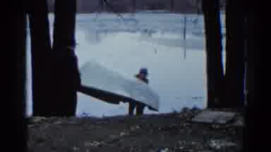 Wauconda Illinois USA (1961): Two Men Are Moving A Boat Into A Lake