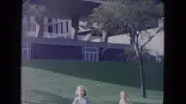 South Carolina USA (1961): Two Young Girls Stand Next To A Street With 1960s Cars