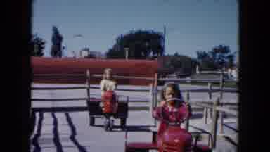 South Carolina USA (1961): Children Riding Self Propelled Rides At Amusement Park