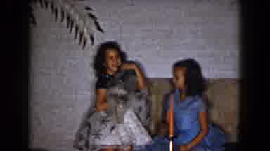 South Carolina USA (1961): Girls Play And Pet A Dog In Their Living Room With