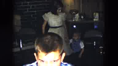 South Carolina USA (1961): Girl Wearing Yellow Dress Walks With Toddler Wearing