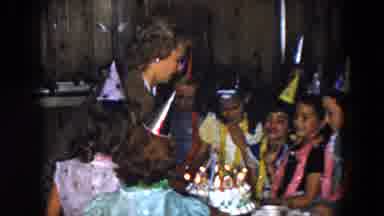 South Carolina USA (1961): Mother Places Birthday Cake On Table For The Children