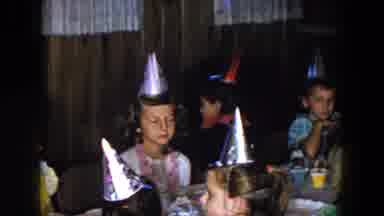 South Carolina USA (1961): A Group Of Young Kids Wearing Party Hats Sitting Around