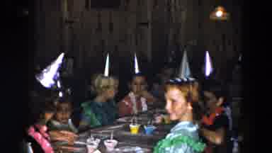 South Carolina USA (1961): A Bunch Of Young Children With Party Hats Surround A