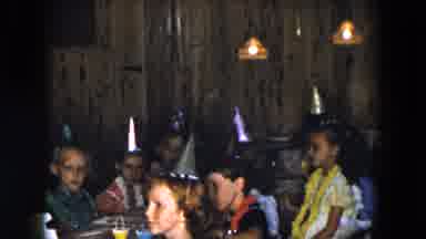 South Carolina USA (1961): Children In Party Hats Sit Around The Table As Mother