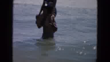 South Carolina USA (1961): A Couple Playing Water Games In The Water