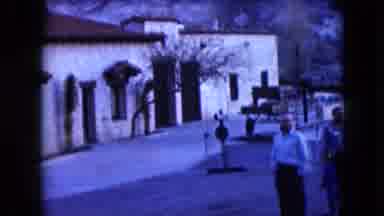 Nevada USA (1961): A Montage Between A House With People In The And A Strip With