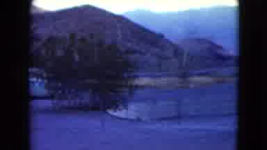 Nevada USA (1961): Scene Of People Walking Near A Parking Lot With Mountains In