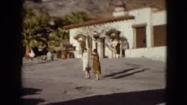 Nevada USA (1961): People In A Parking Lot Of A Building In The Mountains
