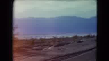 Nevada USA (1961): Passing View Of Mountains And Lake On A Sunny Day