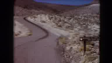 Nevada USA (1961): Long Stretch Of Road Winding Through A Desert Under A Clear