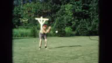 Nevada USA (1961): Father And Son Play A Game Of Catch In The Backyard Together