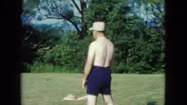 Nevada USA (1961): A Ban With Blue Shirt And White Cap Gets Thrown A Ball And