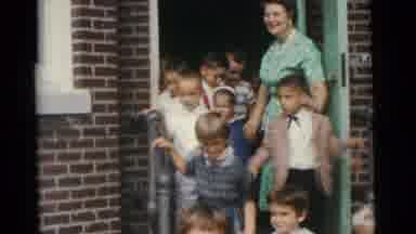 Camden New Jersey USA (1961): Teacher Leads A Group Of Children Out Of The School