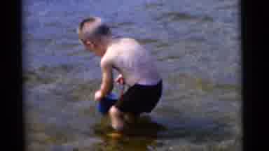 Camden New Jersey USA (1961): Small Boy Collection Rocks In A Lake And Putting