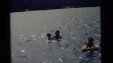 Camden New Jersey USA (1961): Two Men Play With Kids In Lake Using Inflatable Raft