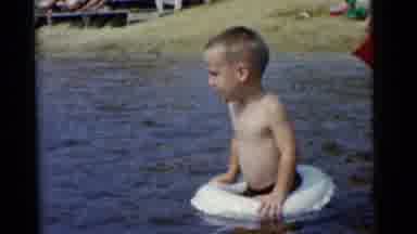 Camden New Jersey USA (1961): Kids Play With Inflatable Water Toys In Lake In A