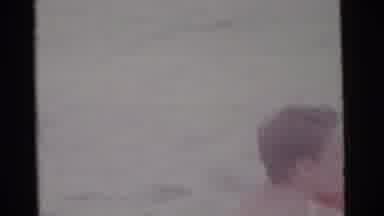 Camden New Jersey USA (1961): He Swims And The Baby Is In The Ocean Together