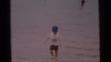 Camden New Jersey USA (1961): The Small Boy Walking In The Water Is Look Like Very
