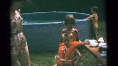 Camden New Jersey USA (1961): Mother Picks Up Something From The Table To Help