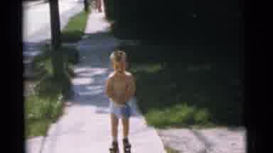 Camden New Jersey USA (1961): Little Boy Wearing Roller Skates Slowly Making His