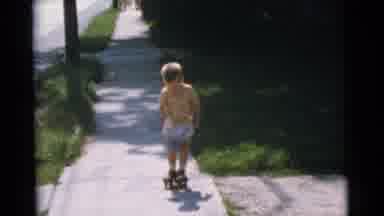 Camden New Jersey USA (1961): A Child Wearing The Scatter Wheel But He Walking In