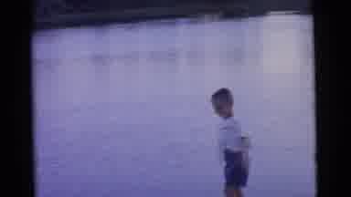 Camden New Jersey USA (1961): Four Children Throwing Rocks Into A Lake As A Man In