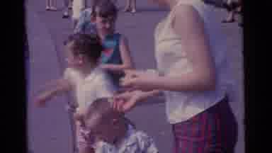 Camden New Jersey USA (1961): A Mother Shows Her Children How To Feed Birds On The