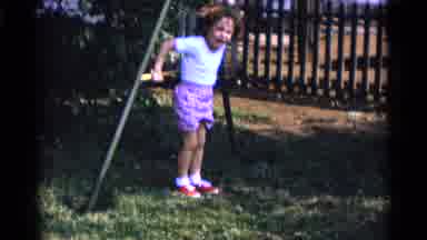 CAMDEN NEW JERSEY USA-1961: Child Plays On Swing Set Bars As Mothers And Other