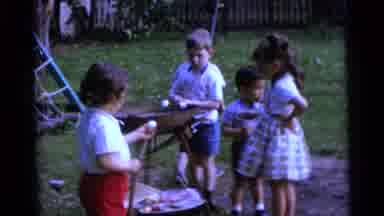 Camden New Jersey USA (1961): Five Children In A Garden Cooking Marshmallows On A