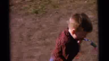 Camden New Jersey USA (1961): Two Kids Playing Outside One Is Playing On The Floor
