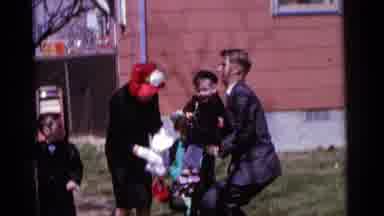 Camden New Jersey USA (1961): A Man Picking A Little Boy And One Lady Giving Toy