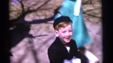 Camden New Jersey USA (1961): A Small Boy Is Caring A Doll In His Hand And Playing