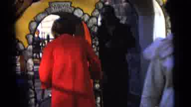 Camden New Jersey USA (1961): Person Dressed In Red Passing Through A Painted