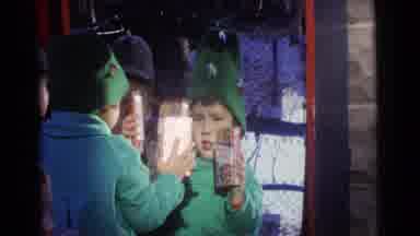 Camden New Jersey USA (1961): Child Wearing Green Coat Holds Box Of Cracker Jack