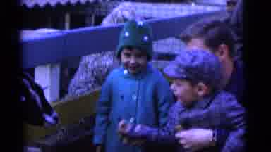 Camden New Jersey USA-1961: Father Helps Son Feed Goat At Petting Zoo