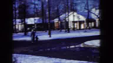 Madison Wisconsin USA (1960): People Walking And Biking On A Clear Street In A
