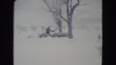Madison Wisconsin USA (1960): A Person Using A Farm Tractor To Clear Snow From A
