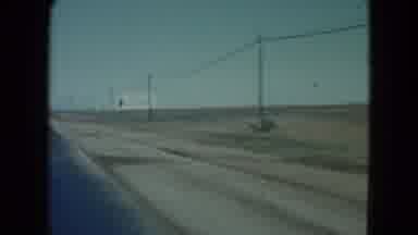 Nevada USA (1960): Driving Down A Highway Dirt Roads & Electric Poles To The Side
