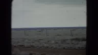Nevada USA (1960): A Prairie With A Fence And Hills In The Background On A Cloudy