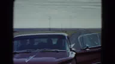 Nevada USA (1960): People In A Classic Red Car That Standing Beside A Highway