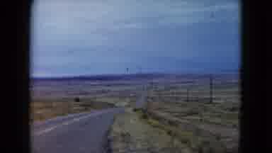 Nevada USA (1960): Desert Scene On A Cloudy Day Of Sides Of Empty Road With