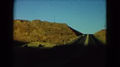 Nevada USA (1960): Long Road Driving Alone Cars Faraway Hills Building