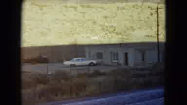 Nevada USA (1960): White Car Parked In Front Of Stony House Deserted Place