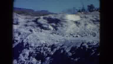 Nevada USA (1960): A View Of A Street Surrounded By Rocky Mountains