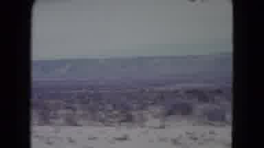 Nevada USA (1960): A Vast Dry And Bushy Land At The Foot Of A Large Mountain Range