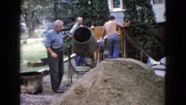Wauconda Illinois USA (1960): Four Men Work On Building A Concrete Porch With