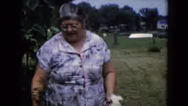 Wauconda Illinois USA (1960): Older Woman And Shirtless Young Man Showing Aspects